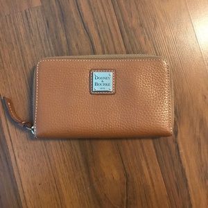 Used Dooney & Bourke zip around wallet.